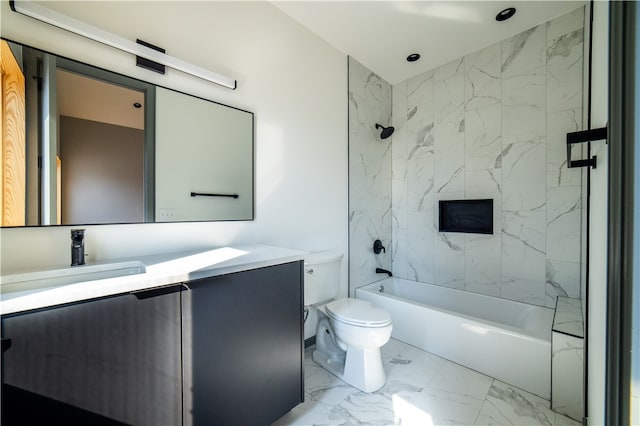 full bathroom featuring toilet, vanity, and tiled shower / bath combo