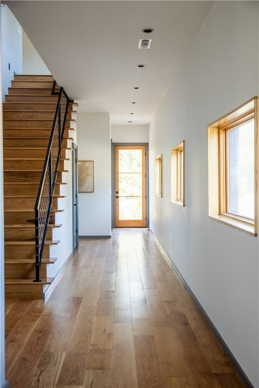 corridor featuring hardwood / wood-style floors