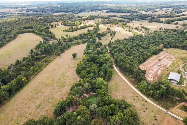 birds eye view of property with a rural view