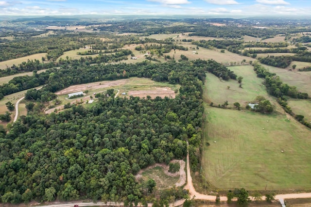 birds eye view of property with a rural view