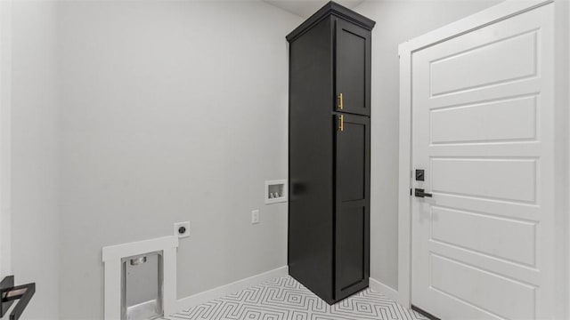 laundry room featuring washer hookup, electric dryer hookup, and cabinets