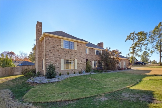 view of front of home with a front lawn