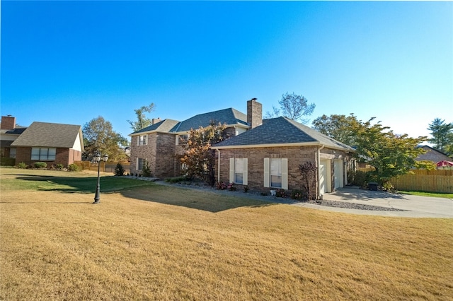 exterior space with a lawn and a garage