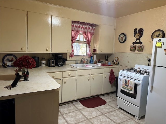 kitchen with white appliances and sink