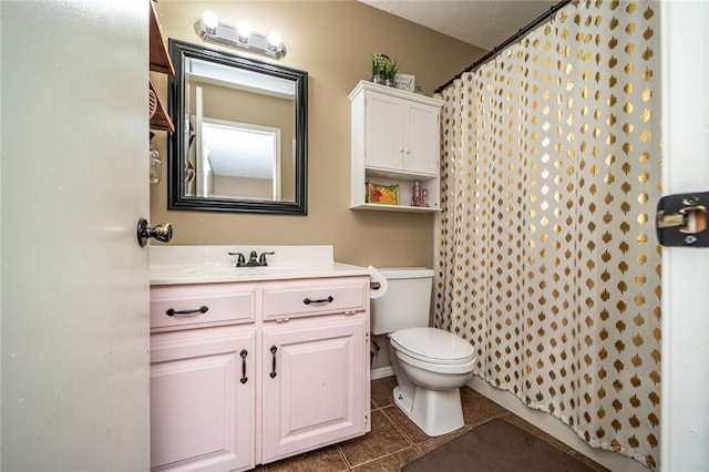 bathroom with a textured ceiling, toilet, vanity, a shower with curtain, and tile patterned flooring