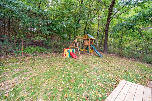 view of playground with a lawn