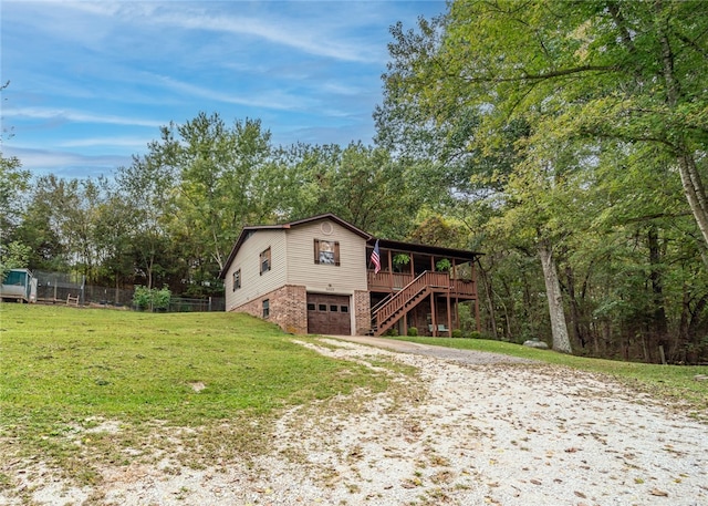 view of property exterior with a garage, a deck, and a lawn