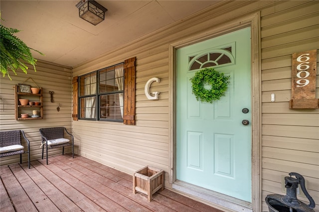 doorway to property featuring a porch