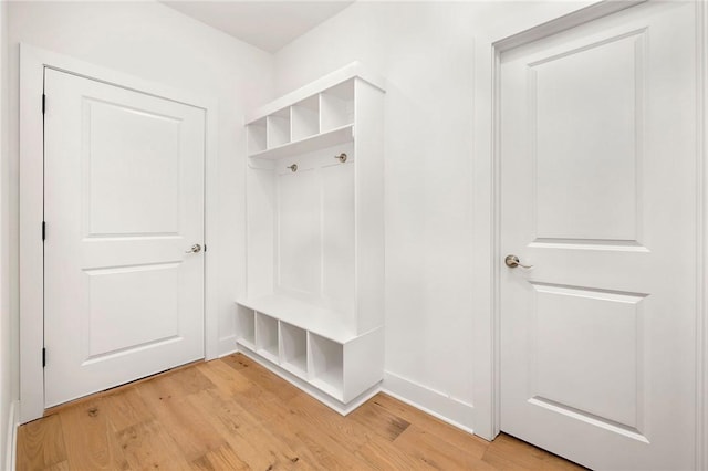 mudroom with light hardwood / wood-style floors