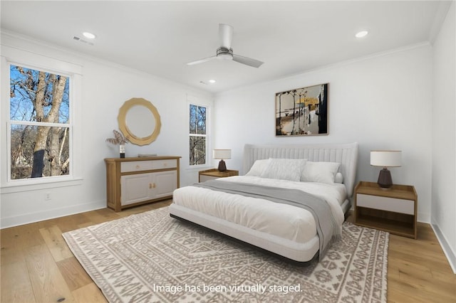 bedroom with ceiling fan, crown molding, and hardwood / wood-style floors