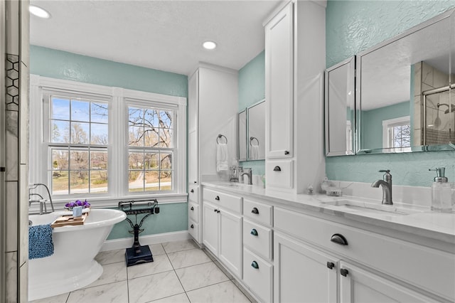 bathroom with vanity, a textured ceiling, plus walk in shower, and tile patterned floors