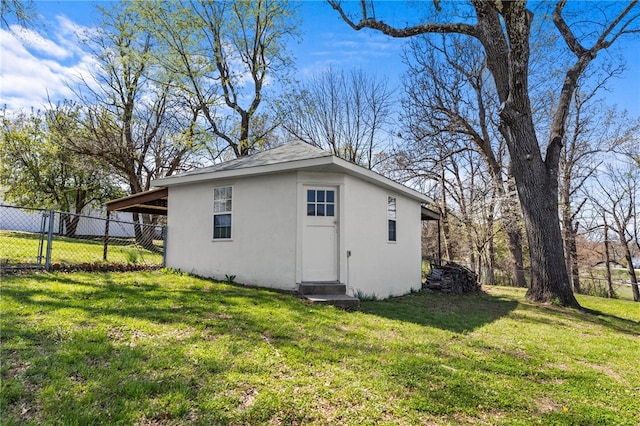 view of outbuilding with a lawn