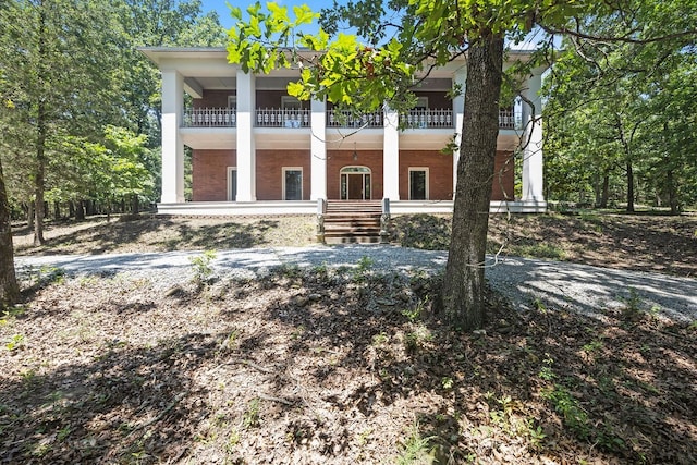 neoclassical home with a balcony