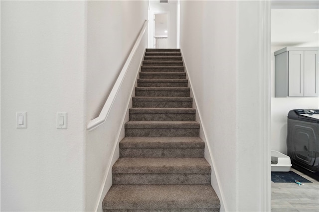 staircase with washer / clothes dryer