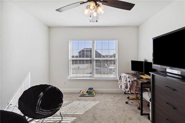 office area featuring light colored carpet and ceiling fan