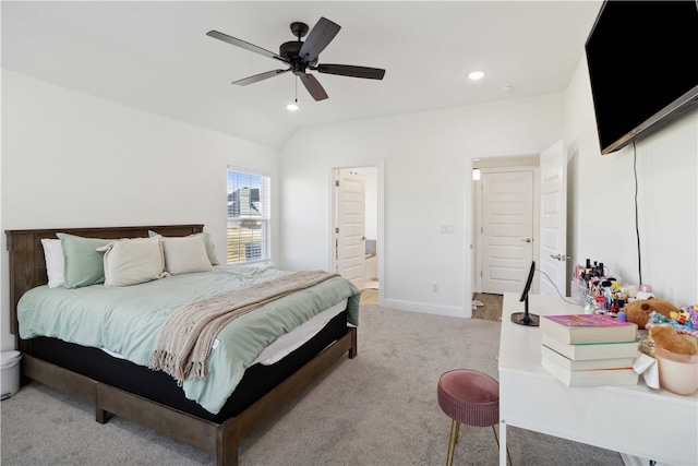 carpeted bedroom with lofted ceiling, ensuite bath, and ceiling fan