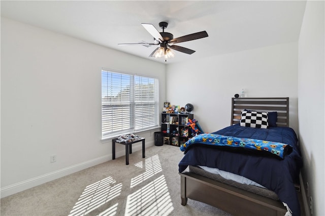 carpeted bedroom with ceiling fan