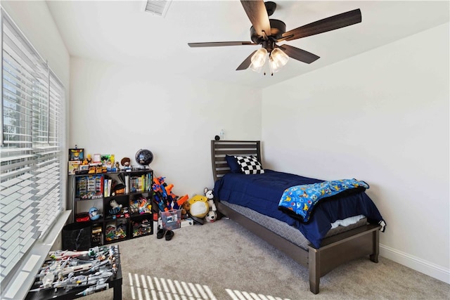 carpeted bedroom with ceiling fan