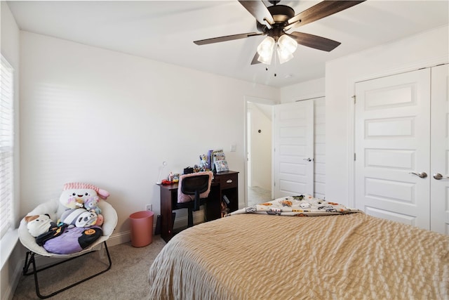 carpeted bedroom featuring two closets and ceiling fan