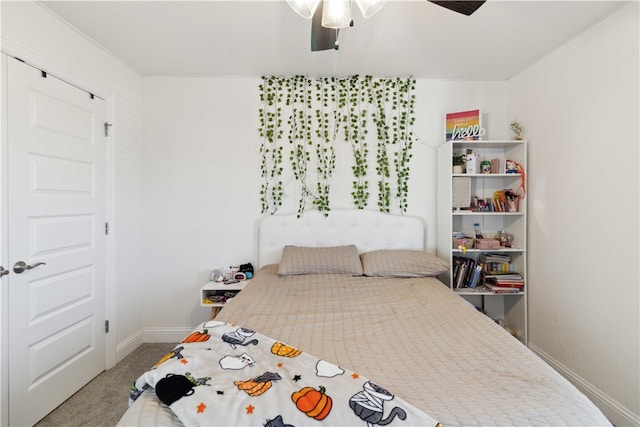 carpeted bedroom with ceiling fan