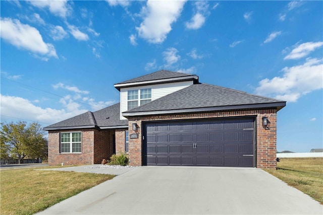 view of front facade featuring a front yard and a garage