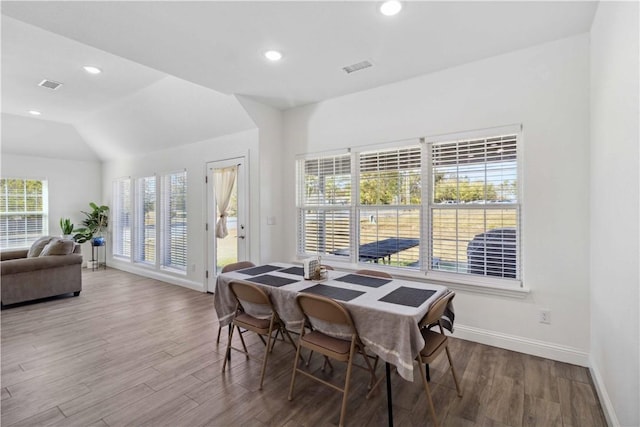 dining space featuring wood finished floors, recessed lighting, visible vents, and baseboards