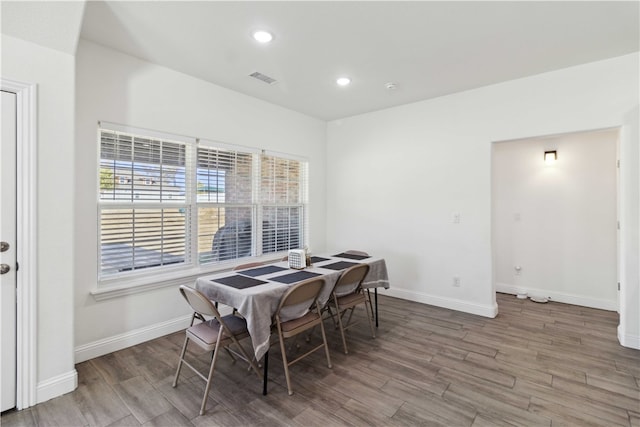 dining room with wood-type flooring