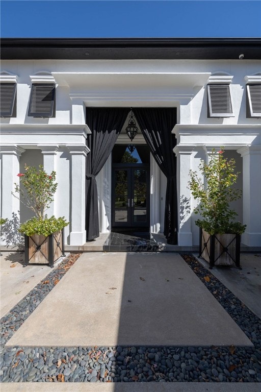 property entrance featuring french doors