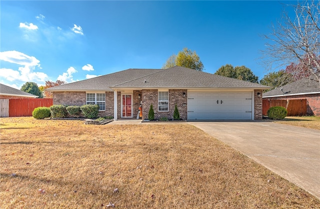 single story home with a front lawn and a garage