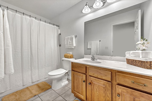 bathroom with a textured ceiling, walk in shower, toilet, vanity, and tile patterned flooring