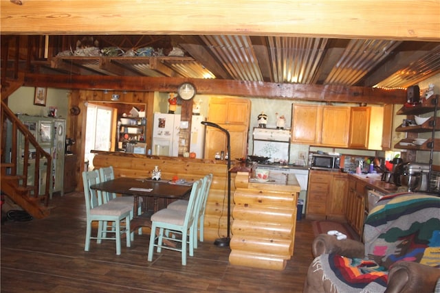 kitchen featuring beam ceiling and dark hardwood / wood-style flooring