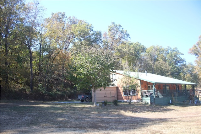 view of front of property featuring covered porch