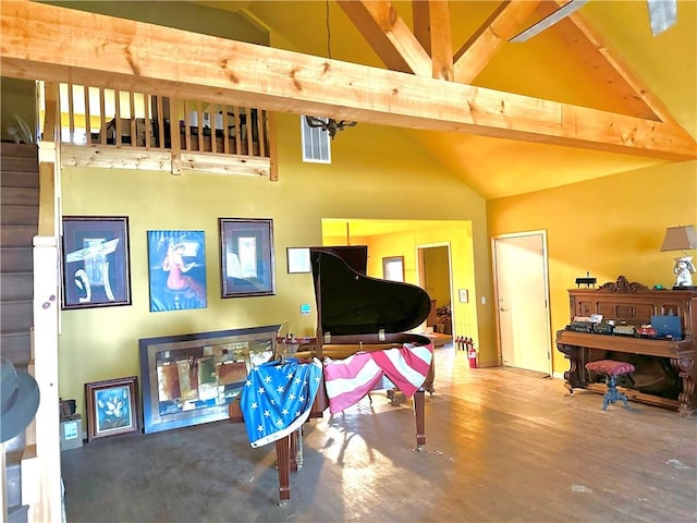 sitting room with high vaulted ceiling, beam ceiling, and wood finished floors