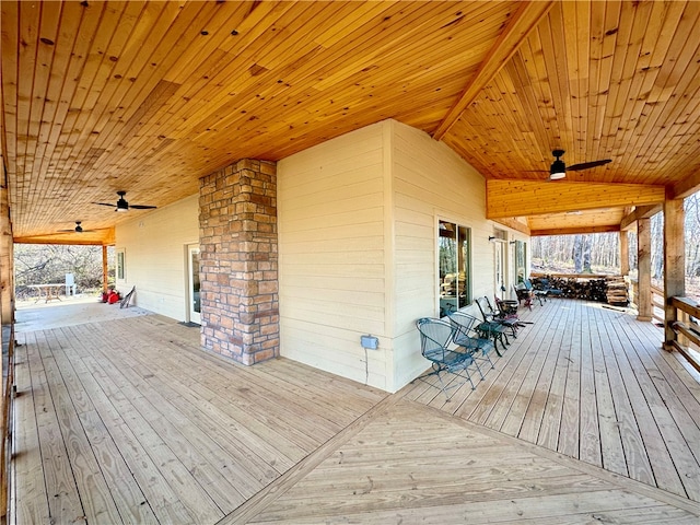 wooden terrace featuring ceiling fan