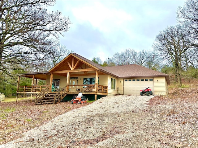 view of front of property with a garage and a porch