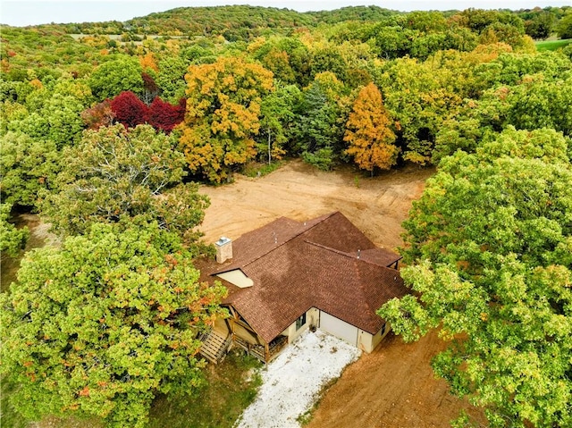 aerial view with a wooded view