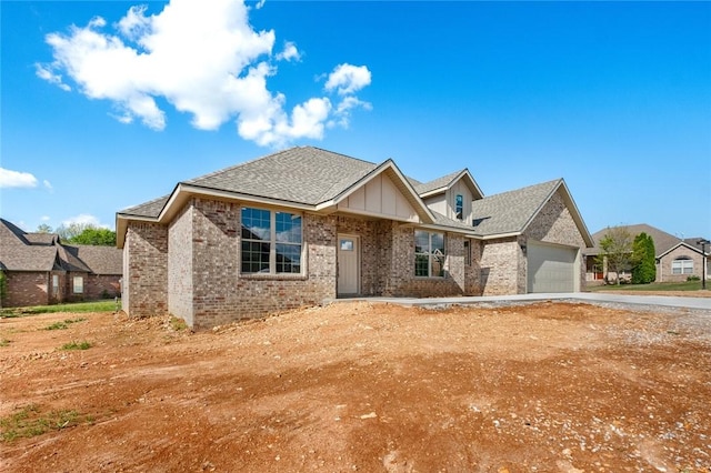 825 Baker St, Pea Ridge, AR 72751 - view of front of home featuring a garage, brick siding, driveway, and roof with shingles