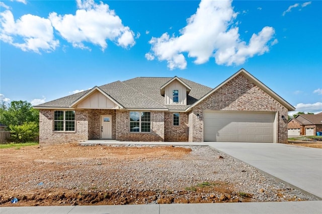 825 Baker St, Pea Ridge, AR 72751 - view of front of property featuring roof with shingles, concrete driveway, brick siding, and a garage