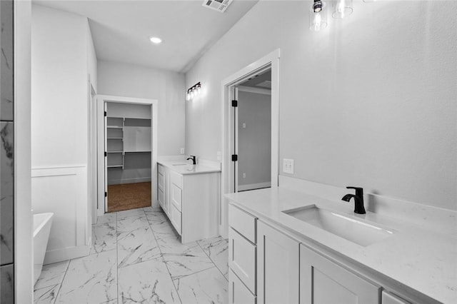 825 Baker St, Pea Ridge, AR 72751 - bathroom with two vanities, visible vents, marble finish floor, and a sink