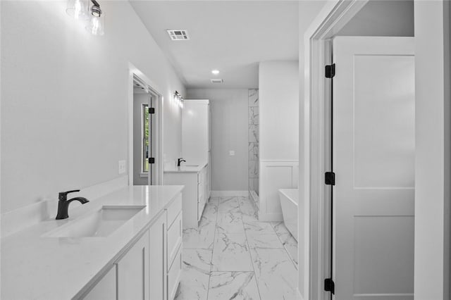 825 Baker St, Pea Ridge, AR 72751 - bathroom with two vanities, a shower stall, marble finish floor, a sink, and visible vents