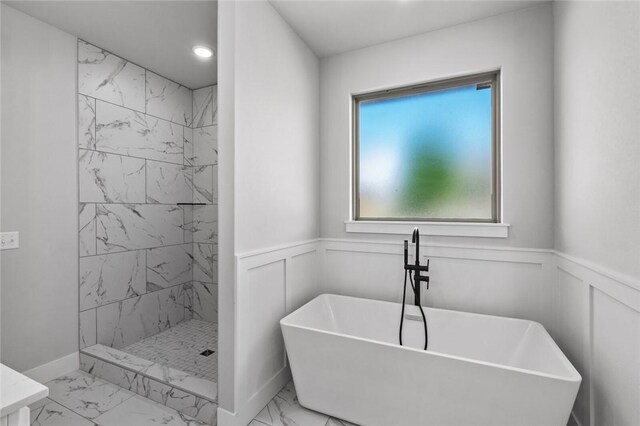 825 Baker St, Pea Ridge, AR 72751 - full bath featuring a soaking tub, tiled shower, a decorative wall, marble finish floor, and wainscoting