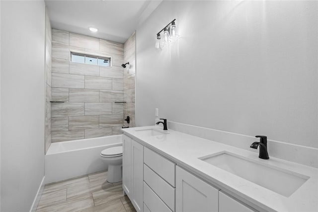 825 Baker St, Pea Ridge, AR 72751 - bathroom featuring double vanity, toilet, tub / shower combination, and a sink