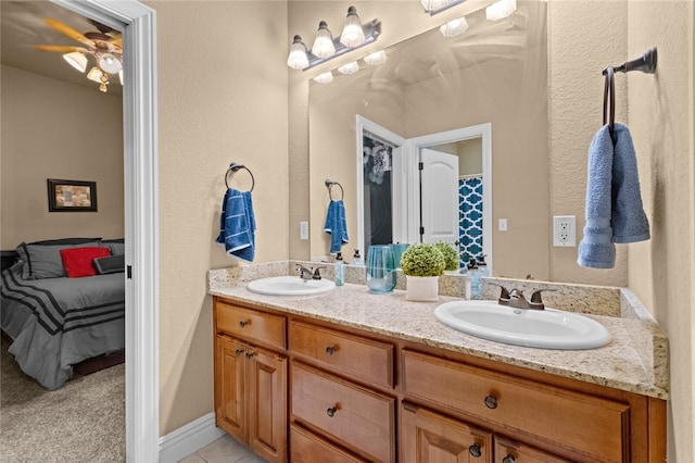 bathroom featuring vanity and ceiling fan