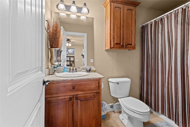 bathroom with vanity, ceiling fan, tile patterned floors, and toilet