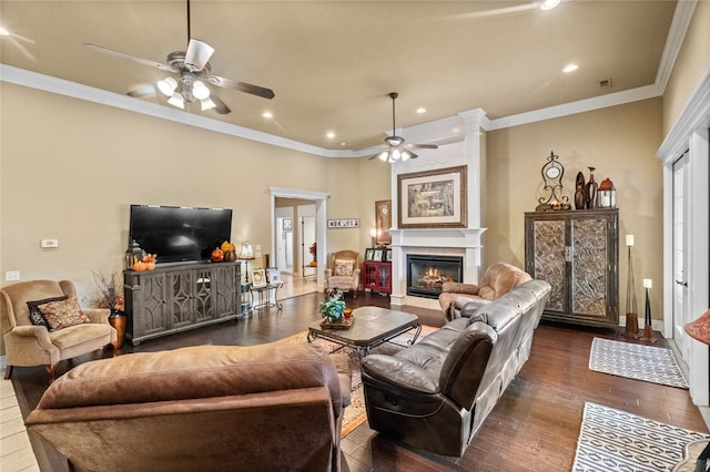 living room with ceiling fan, dark hardwood / wood-style flooring, and ornamental molding