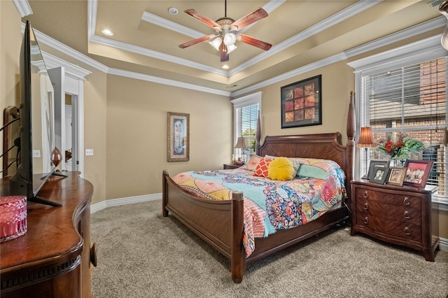 carpeted bedroom featuring a raised ceiling, ceiling fan, and crown molding