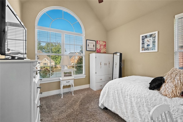 carpeted bedroom featuring ceiling fan and vaulted ceiling