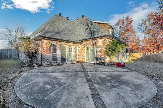 rear view of property featuring a patio