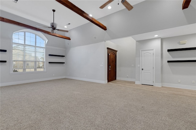 unfurnished living room featuring beam ceiling, light carpet, ceiling fan, and high vaulted ceiling