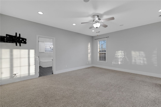 carpeted empty room featuring ceiling fan